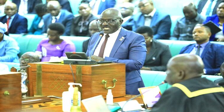 Gen. Katumba Wamala tabling the aviation Bill for First Reading. The minister is counting on MPs to avert the looming crisis