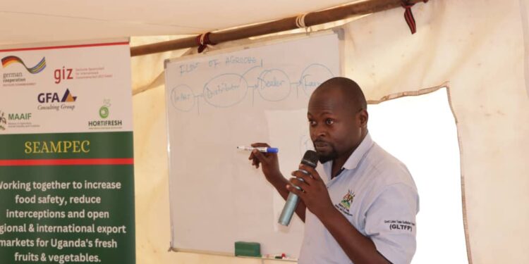 Dr. Ssamula Alexander the Senior Inspector MAAIF Department of Crop Inspection and Certification train Agro-Input Dealers at Hortifresh Secretariat in Mengo along Balintuma Road.