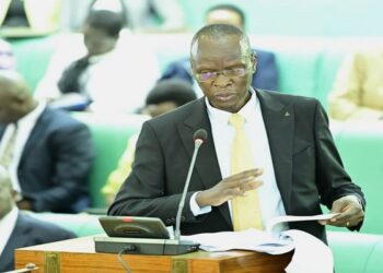 The Deputy Chairperson of the Budget Committee, Hon. Remigio Achia, presenting their report