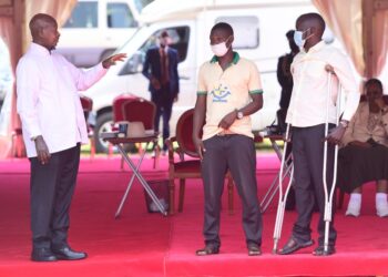 President Museveni with Moses Ssimbwa (extreme right) during the 38th NRM victory day anniversary celebrations in Jinja