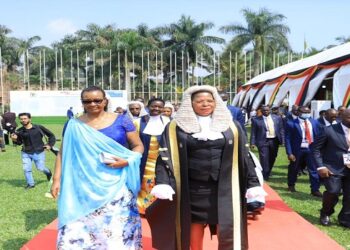 Speaker Among (R) with her Rwandese counterpart, Rt Hon Donatille Mukabalisa lead other presiding officers to the plenary area after the taking of the official photo