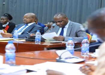 Musasizi (2nd R) with hiscolleague Amos Lugoloobi (C) and Permanent Secretary, Ramathan Ggoobi to the right