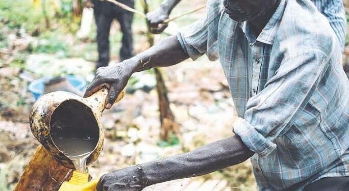 A man filling a jerrycan with tonto