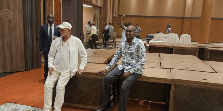 Sudhir and Frank Tumwebaze oversee last touches on the hall ahead of the summits