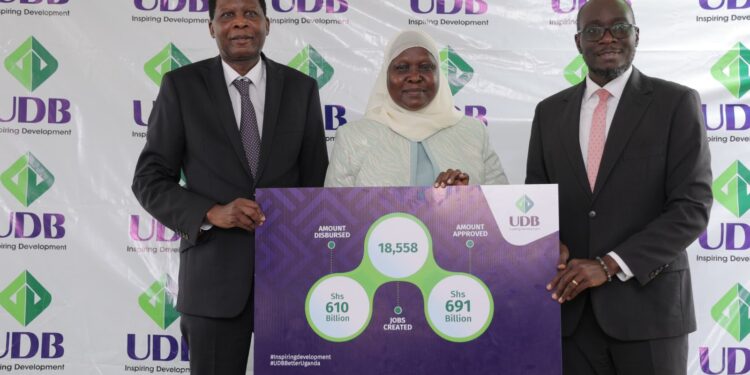 Sarah Wasagali (c) is flanked by UDB Ag. MD Denis Ochiend (L) and Dr.David Alobo at Nkonge Solar Plant during a press briefing on Wednesday