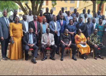 Hajj Kakande in a group photo with the participants