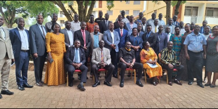 Hajj Kakande in a group photo with the participants