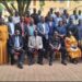 Hajj Kakande in a group photo with the participants