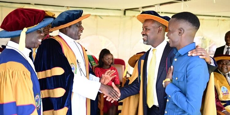 The Deputy Speaker, Thomas Tayebwa (second right) interacting with top university officials and a student (right)