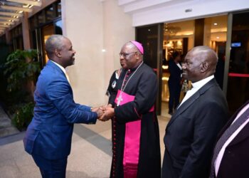 Archbishop Paul Ssemwogerere (centre) welcoming the Deputy Speaker, Thomas Tayebwa, at the Memorial Lecture held at Hotel Africana on Thursday, 07 March 2024