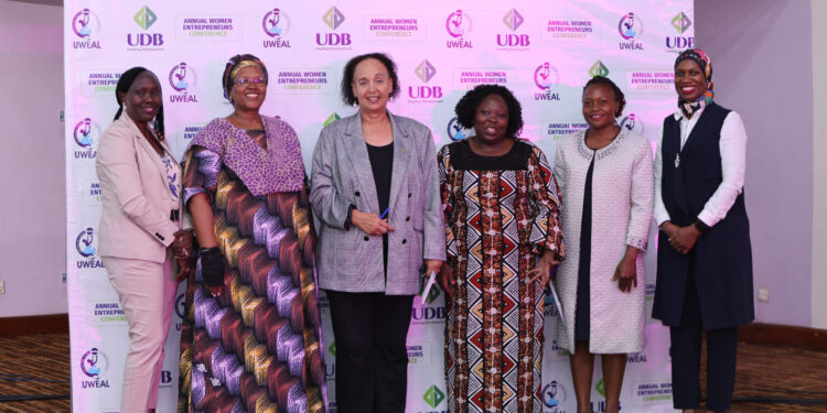 Dr. Maggie Kigozi (3rd Left] is flanked by Women entrepreneurs at Hotel Africana on Thursday