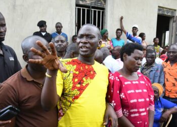 Kagoma North MP in Jinja Alex Brandon Kintu explains to the residents of Buyengo Town Council on the progress of the Health Centre under renovation.