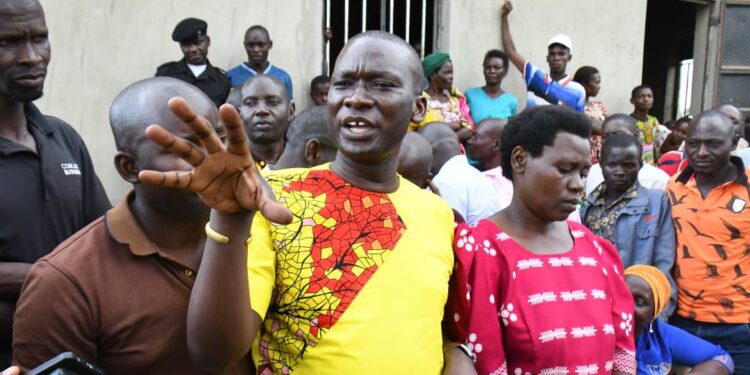 Kagoma North MP in Jinja Alex Brandon Kintu explains to the residents of Buyengo Town Council on the progress of the Health Centre under renovation.