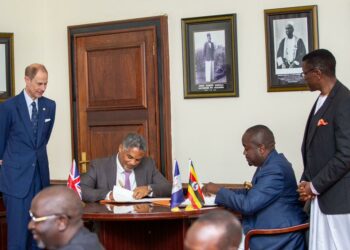 William Blick, Chairman Board of Trustees signed on behalf of the Program - Uganda Chapter and Omuk. Sebuwufu Roland - Chief Executive, Buganda Investments and Commercial Undertakings signed on behalf of Buganda Kingdom.