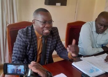 The JRRH BOG chairman Dr David Mukisa addresses journalists at the Board Room as Peter Kisambira, a Board member listens.