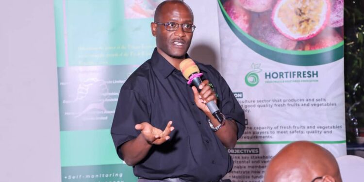 Fred Zake, the Executive Director of Hortifresh Association Uganda Limited, making his keynote on the Food Safety Dialogue at Fairway Hotel in Kampala.