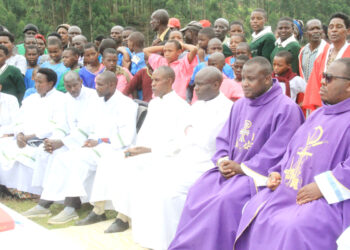 PRIESTS DURING MASS AT THE DISPUTED LAND