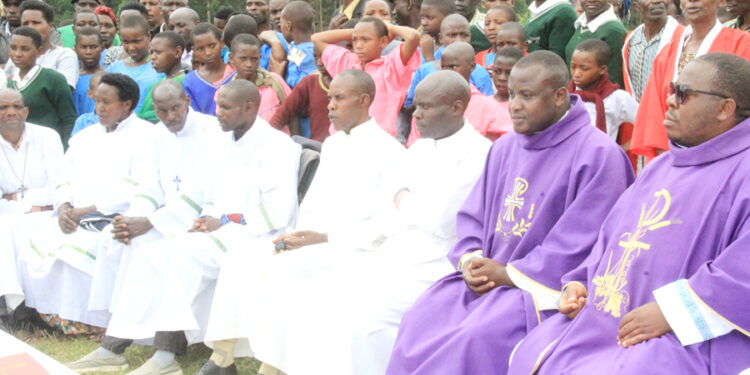 PRIESTS DURING MASS AT THE DISPUTED LAND