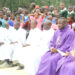 PRIESTS DURING MASS AT THE DISPUTED LAND
