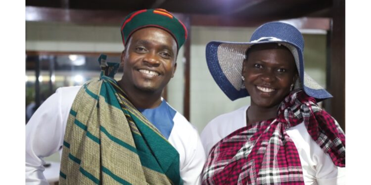 Robert Sharp Mugabe shares a light moment with Lt. Akullo Vivien at the cultural gala.