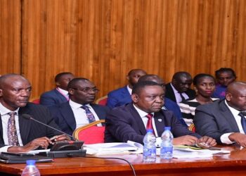UNRA’s Director for Roads and Bridges, Eng. Samuel Muhoozi (left) leading the UNRA team appearing before COSASE on Wednesday, 13 March 2024
