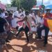 Some female health workers dance provocatively flashing their backs and thighs to the DPC Innocent Mubangizi.