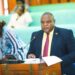 Hon. Tonny Ayoo, presenting the committee report to Parliament