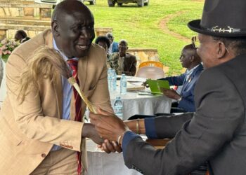 Hon Cedric Vincent Obong-Eyit, the MP Lira City West gets a rare opportunity to shake hands with the Won Nyaci-elect HRH Eng Dr Michael Moses Odongo Okune.