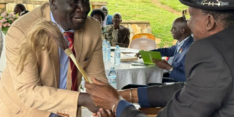 Hon Cedric Vincent Obong-Eyit, the MP Lira City West gets a rare opportunity to shake hands with the Won Nyaci-elect HRH Eng Dr Michael Moses Odongo Okune.