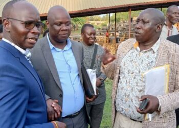 GCW Hon Denis Hamson Obua chats with Prof Willy Okullo of Kyambogo University and Dr Patrick Olet of Gracious Group of Companies after their first meeting for the Coronation Programme.