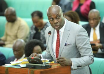 Hon. Fred Opolot, presenting the Committee Report to Parliament