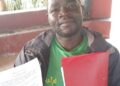 Robert Wesonga, the Group Secretary, holds a copy of the Sale Agreement and a file for the land containing documents in question.