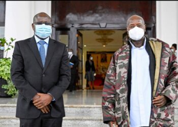 Edward Akol with President Museveni