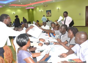 Public Health stakeholders conduct the RCCE Toolkit pre-test exercise at the Imperial Royale Hotel, Kampala City,  under the supervision of USAID SBCA Team . (PHOTO/USAID SBCA)