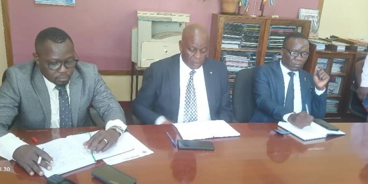 The Jinja RCC Richard Gulume (M),Town Clerk Edward Lwanga (R)and Dr David Charles Mukisa at a news conference.