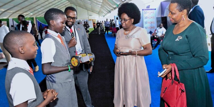Dr. Musenero (Middle), Col. Nakalema, Dr. Bruce Kirenga with young innovators