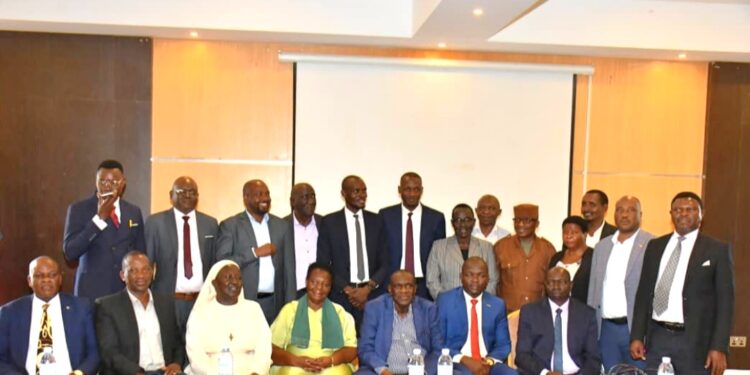 Hajji Kakande in a group photo with Officials from the office of the President and RDCs