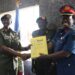 New DWA Brig Gen Charity Bainababo receiving office tools from outgoing Acting DWA Col. Lydia Nandudu during the hand over ceremony at MoDVA Mbuya