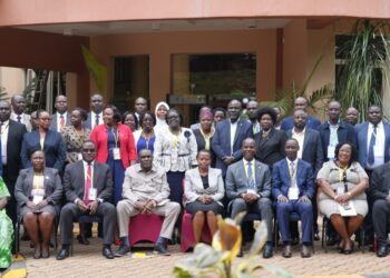 Hajji Kakande and Ms. Nakyobe with administrative officers