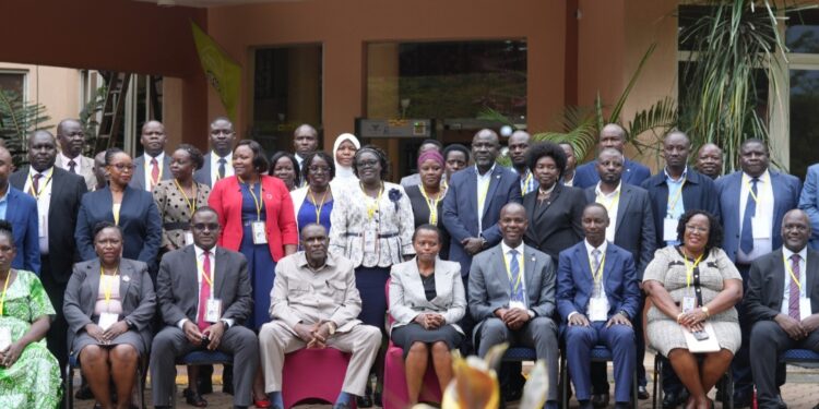 Hajji Kakande and Ms. Nakyobe with administrative officers