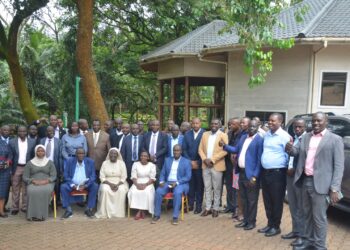 Hajji Kakande, officials from the Office of the President in a group photo with the participants