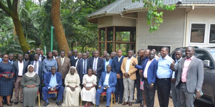 Hajji Kakande, officials from the Office of the President in a group photo with the participants