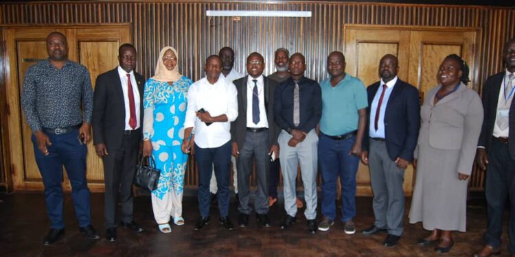 Members of the Southern Division Area Land Committee pose for a group photo with the Jinja City leadership