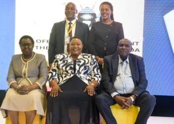 Seated, left to right: The Deputy Head of Public Service and Deputy Secretary to the Cabinet, Dr. Theopista Mary Wenene,  Hon. Babalanda and Haji Kakande